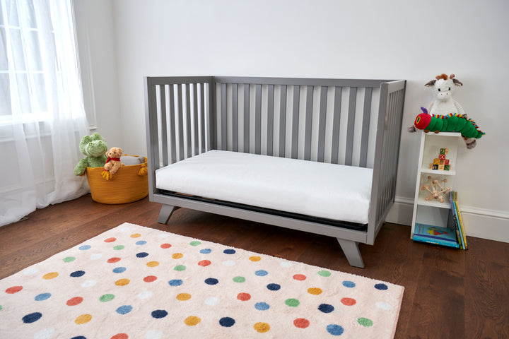 2-Stage Mattress with Dual Firmness: One side is firmer for infants, and the other is cushion-firm for toddlers.