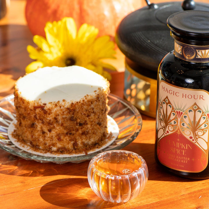 Magic Hour Pumpkin Spice Cake Batter Breakfast Violet Glass Apothecary Jar with a cake on a glass plate